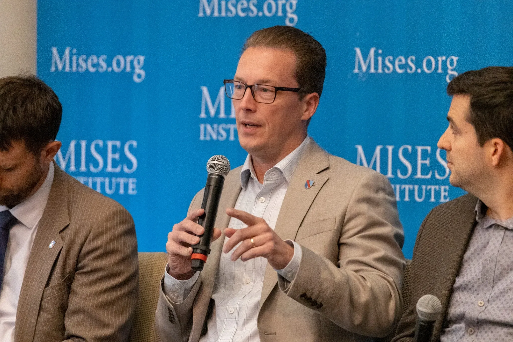 Faculty panelist speaking into a microphone