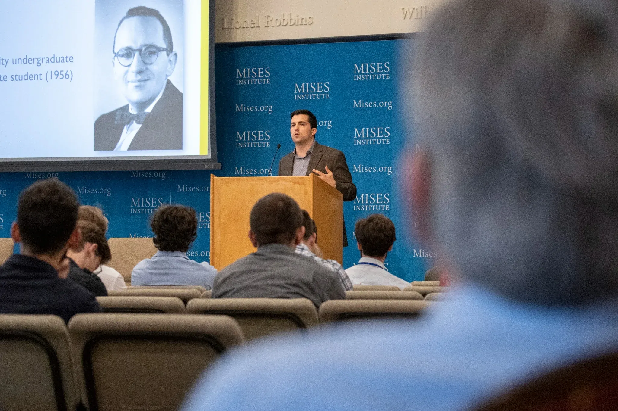 A faculty lecture before a student audience