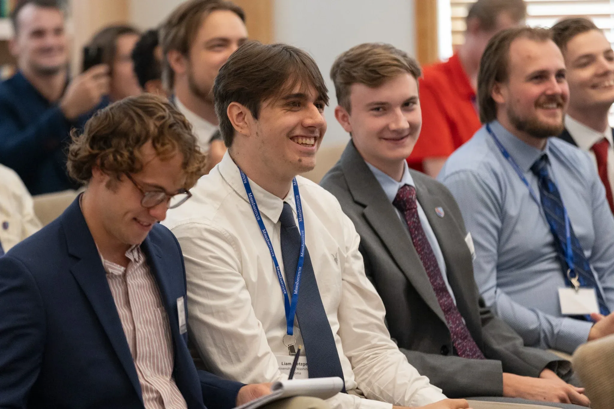 Students smiling in a lecture hall