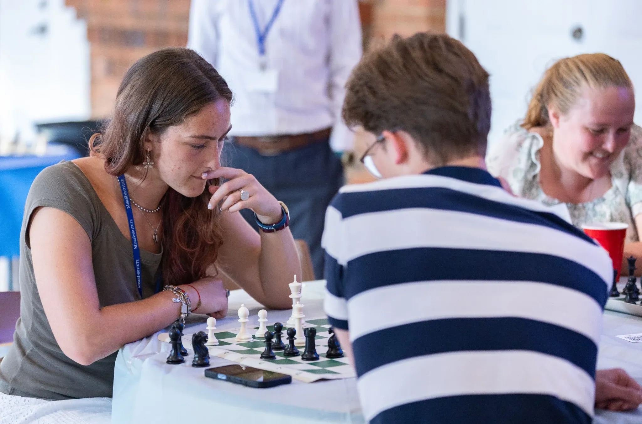 Students playing chess together