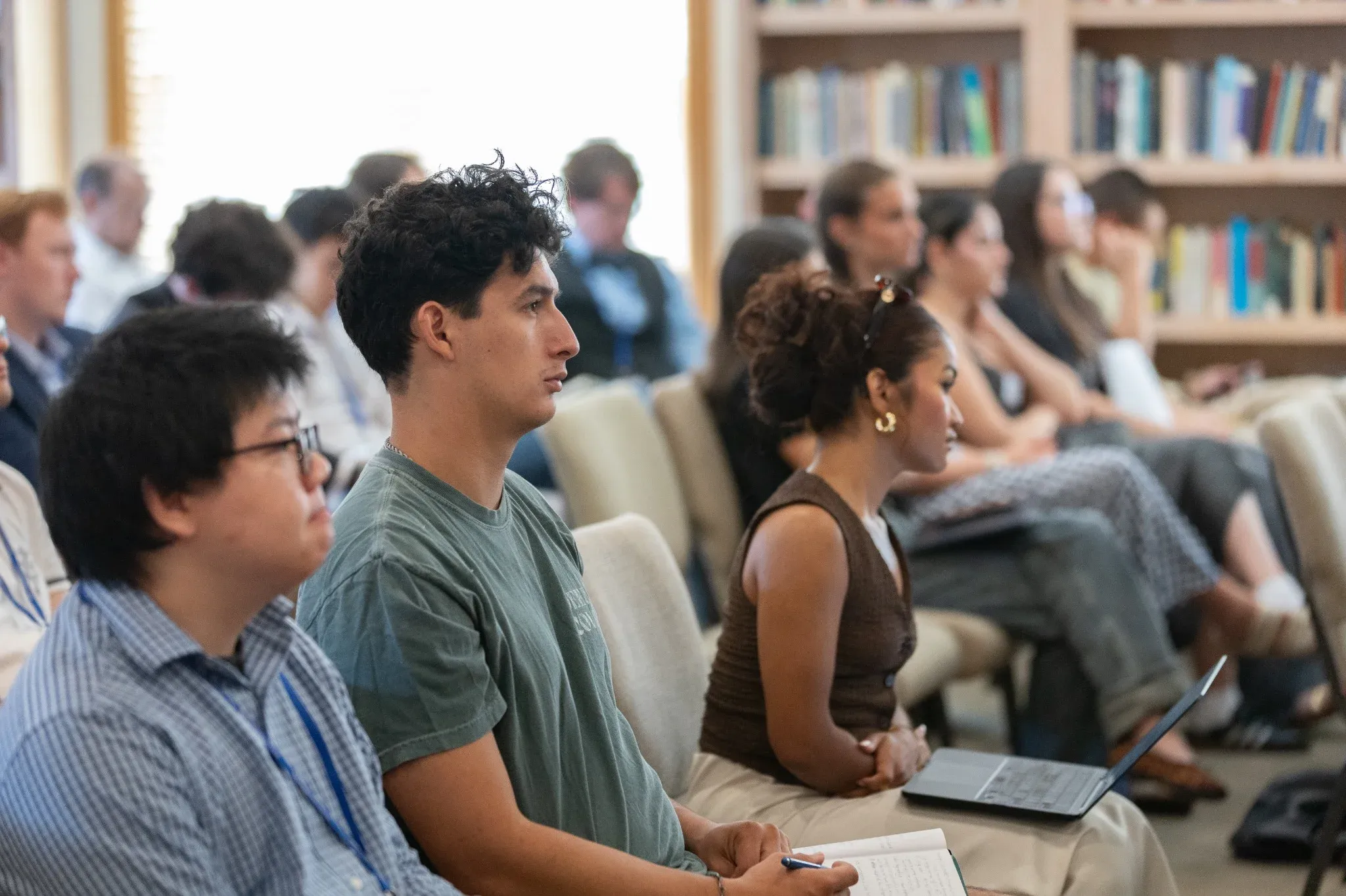 Students taking notes during a lecture