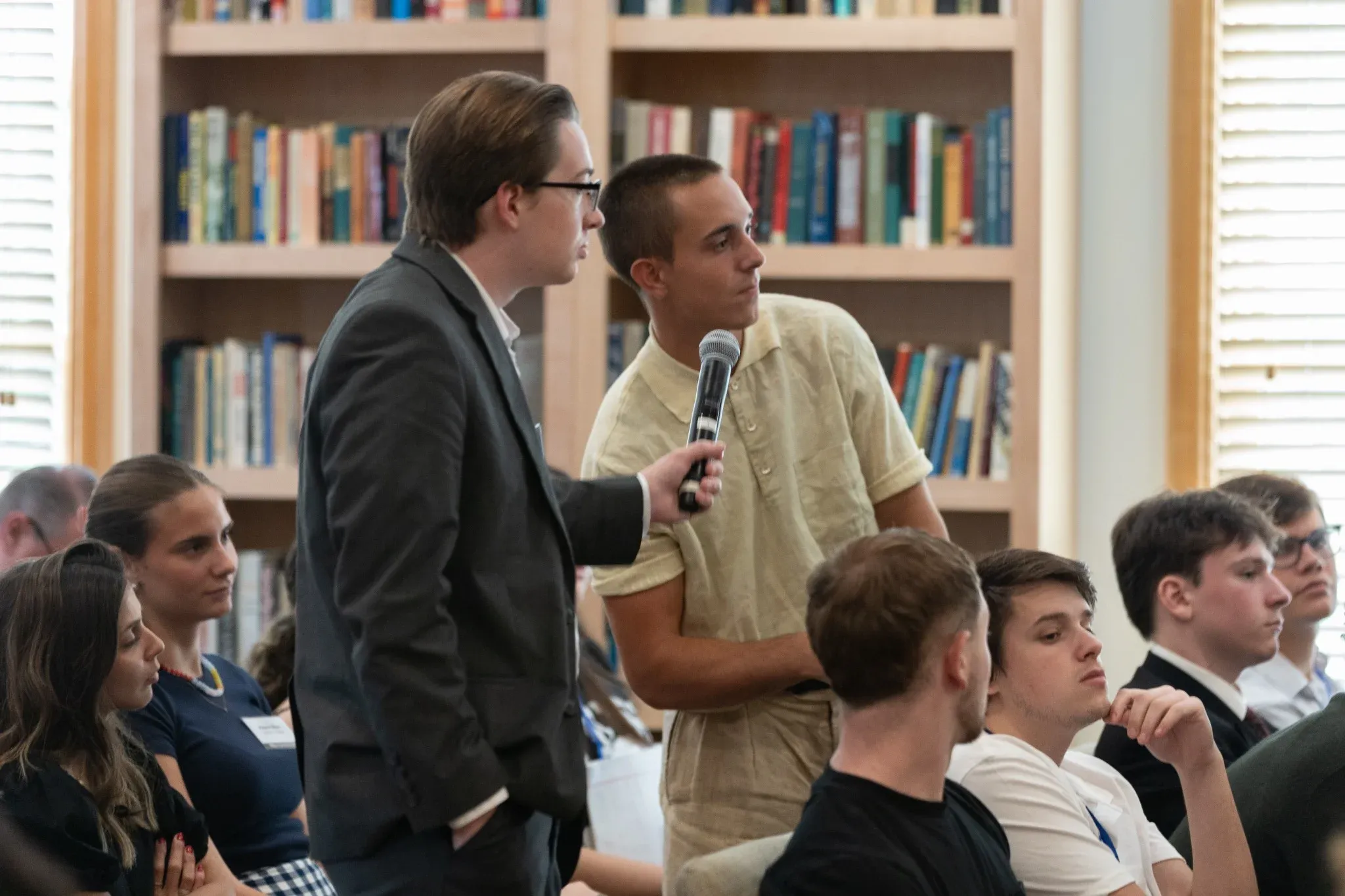 Faculty discussion with students in the library